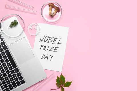 Composition with laptop, plant samples and NOBEL PRIZE DAY greeting card on p Stock Photos