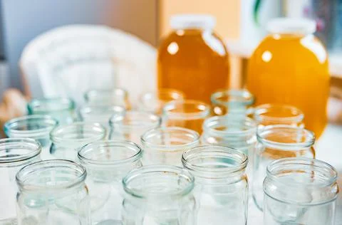 Composition of a large number of jars and three jars of honey standing on a Foto stock