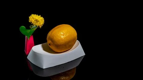 Composition with lemon bathing on a black background Foto stock