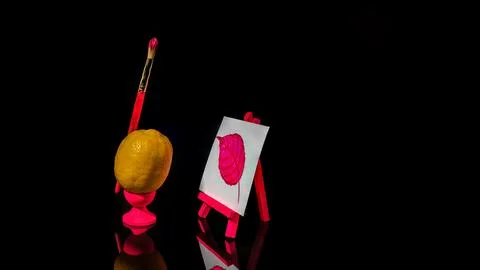 Composition with lemon at the easel on a black background Foto stock