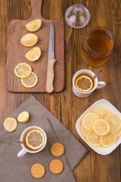 Composition with lemon tea on a wooden table Stock Photos