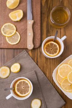 Composition with lemon tea on a wooden table Stock Photos