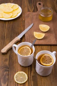 Composition with lemon tea on a wooden table Stock Photos