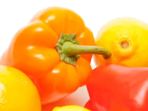 Composition from lemons and peppers Stock Photos