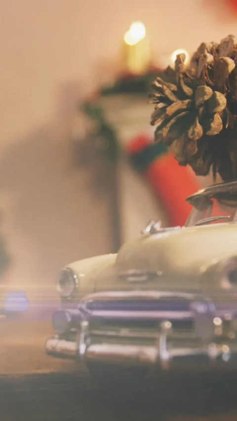 Composition of light over christmas decorations with car and pine cone Stock Footage 344525005