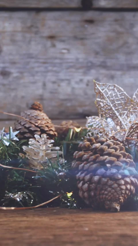 Composition of light over christmas decorations with pine cones Stock Footage 344594725