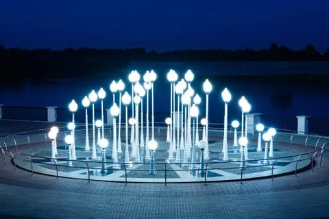 Composition Lighthouse from evening burning lanterns made antique. Installati Stock Photos