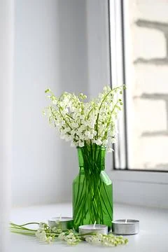 Composition of lily of the valley. Spring concept. A gift to a woman. Stock Photos
