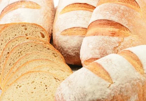 Composition with loafs of bread isolated on white background Stock Photos