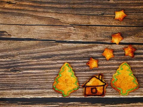 Composition made from cookies in shape of house, Christmas trees and stars Stock Photos