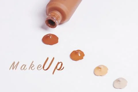 Composition of makeup drops in various shades isolated on a white background Stock Photos