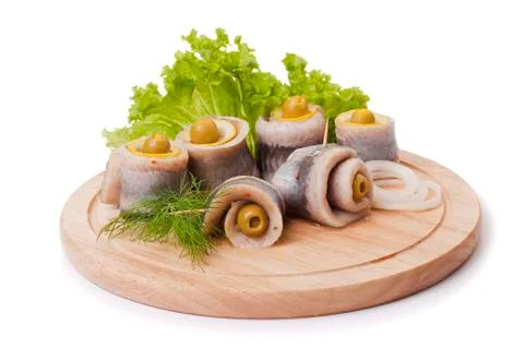A composition with marinated herring rolls Stock Photos