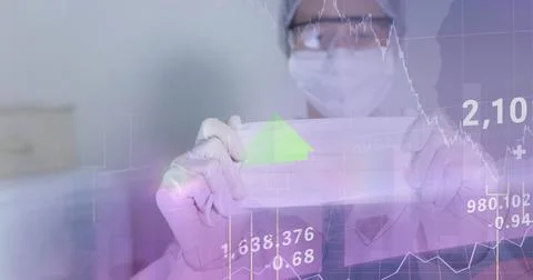 Composition of medical data processing over doctor in ppe suit holding face mask Foto stock