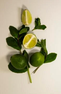 Composition of mint leaves and lime fruit. Green detox. Health care. Top view Stock Photos