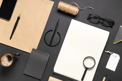 Composition with mobile phone, cup of coffee, scissors and delivery paper bag Stock Photos