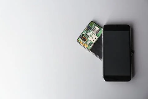 Composition with mobile phones on grey background, top view with space for te Stock Photos