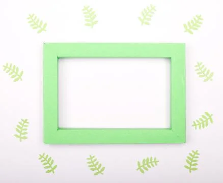 Composition of mockup frame with crafting paper leaves. Stock Photos