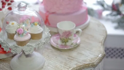 The composition mug with pink flowers and cakes. Abstract background Video stock 69808124