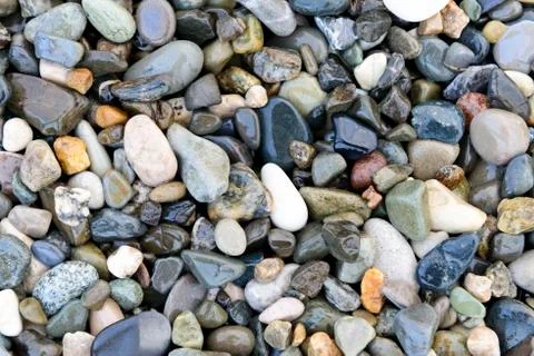 Composition of multicolored sea pebbles background Stock Photos