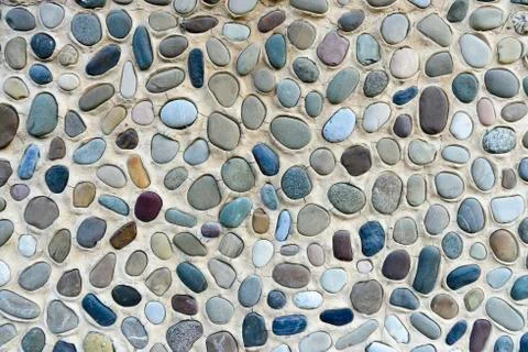 Composition of multicolored sea pebbles background Stock Photos