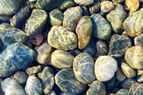 Composition of multicolored sea pebbles background Stock Photos