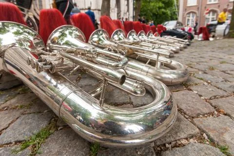 Composition of musical instruments on the ground in a row. Stock Photos