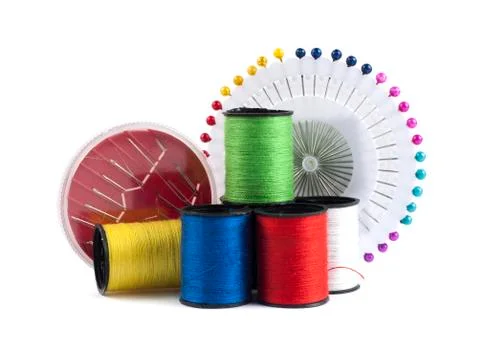 Composition with needles and threads over white background Stock Photos