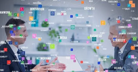 Composition of network of connections with icons over businessmen talking in Foto stock