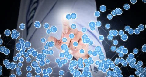 Composition of network of connections with icons over businessman touching Stock Photos
