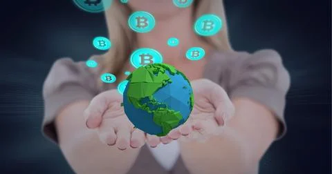 Composition of network of digital bitcoin icons with globe over hand of 스톡 사진