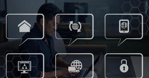 Composition of network of speech bubbles with icons over man using laptop Stock Photos