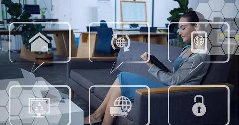 Composition of network of speech bubbles with icons over woman using tablet Stock Photos
