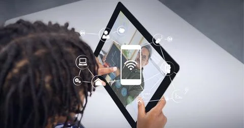 Composition of network of wifi icons over male teacher on tablet online lesson Foto stock