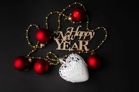 Composition of New Year,bright red-colored games and inscription with the new Stock Photos
