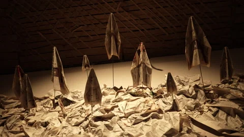 Composition of newspaper airplanes on the wall on a black background Stock Footage 288442869