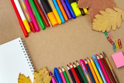 Composition with notebook blank page colorful pencil, marker and pen mock-up  Stock Photos