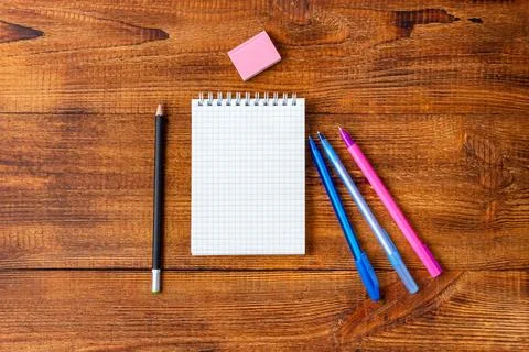 Composition with notebook blank page colorful pencil, marker and pen mock-up  Stock Photos