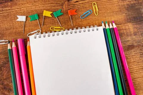 Composition with notebook blank page colorful pencil, marker and pen mock-up  Stock Photos