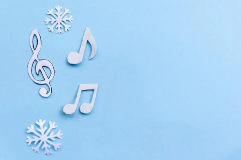 Composition with notes and christmas decorations on blue background Stock Photos