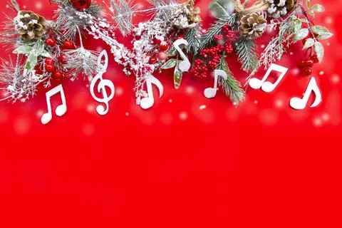 Composition with notes and christmas decorations on red background. Stock Photos