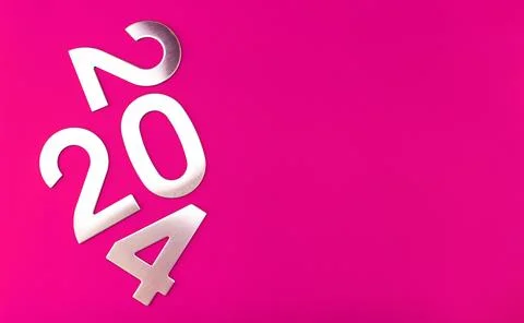 Composition with the number 2024 made of silver on a pink monochrome background Stock Photos