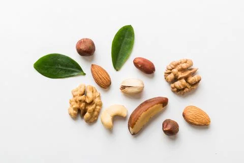 Composition of nuts , flat lay - mix hazelnuts, cashews, almonds on table b.. Stock Photos