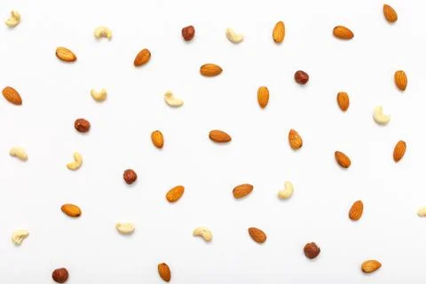 Composition of nuts pattern - mix hazelnuts, cashews, almonds. Stock Photos