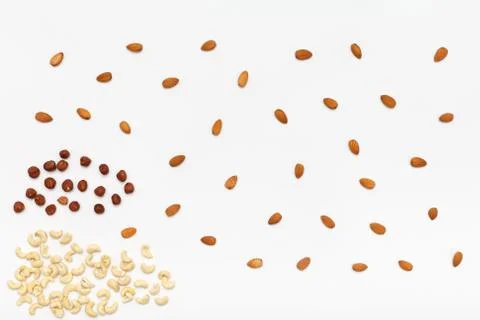 Composition of nuts pattern - mix hazelnuts, cashews, almonds. Stock Photos