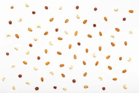 Composition of nuts pattern - mix hazelnuts, cashews, almonds. Stock Photos