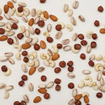 Composition of nuts pattern - mix hazelnuts, cashews, almonds, pistachios. 写真素材