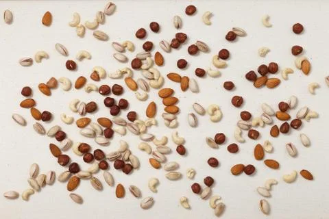 Composition of nuts pattern - mix hazelnuts, cashews, almonds, pistachios. 写真素材