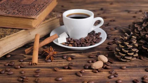 Composition of the old books and cup of coffee on a wooden table. Stock Footage 129593442