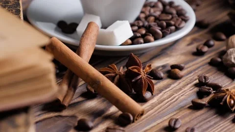 Composition of the old books and cup of coffee on a wooden table. Stock Footage 131006139