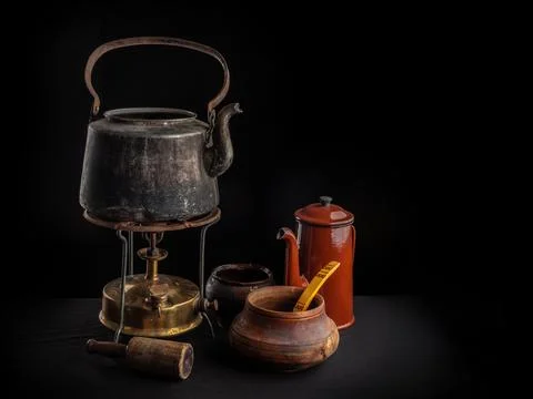 Composition of old kitchen utensils standing on the table Stock Photos